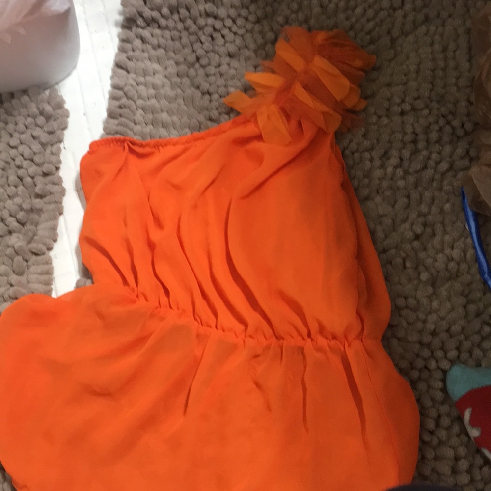 A shirt but is a half shoulder